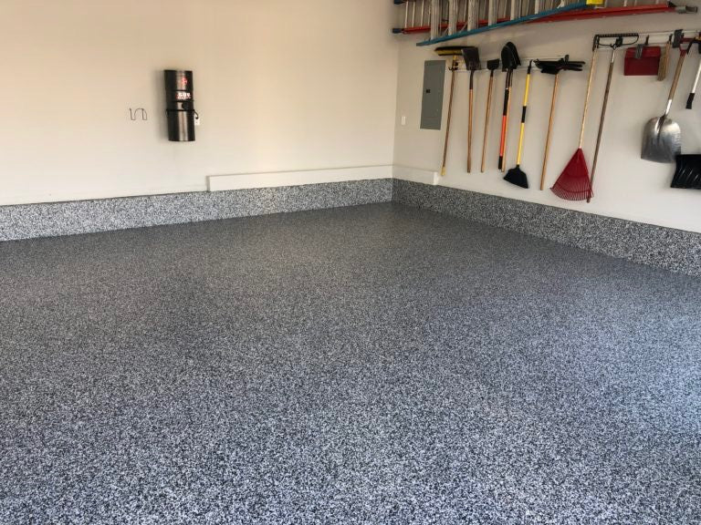 Dark gray epoxy garage flooring.